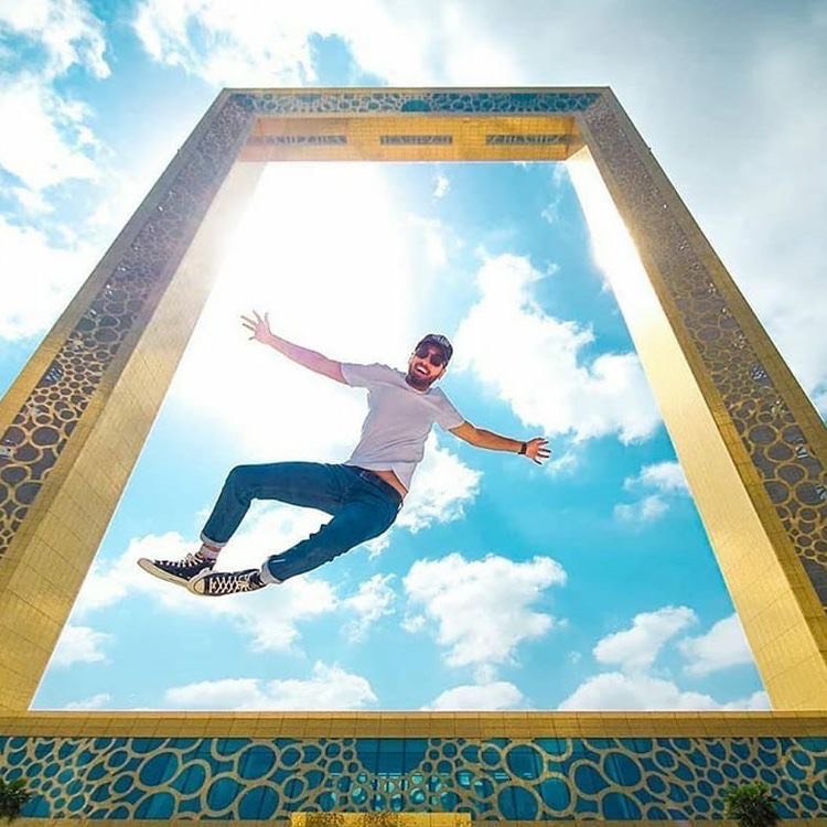 A boy jumping on Dubai Frame Tower